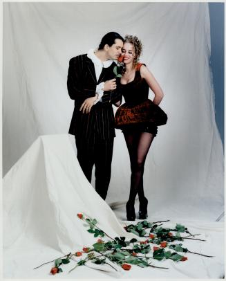 Simon Lugassy wears a Matsuda suit and Donna Saslove wears Vivienne Westwood's bodice, skirt and shoes, all from F/X