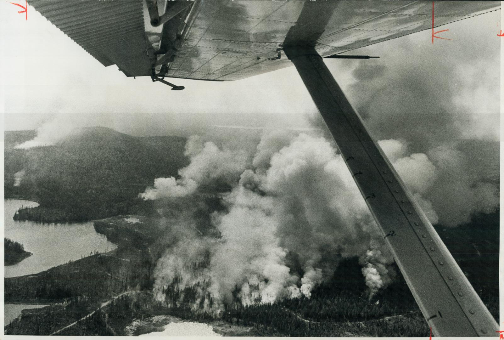 Three forest fires can be seen from plane flying over the Swastika Forest District, where two fires are raging out of control and 13 are considered un(...)