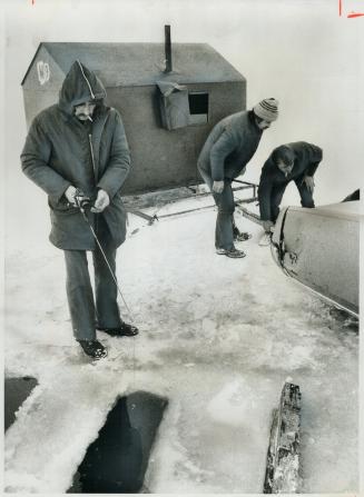 Winding up the season. Ice fishing huts, by law, must be off lakes by the end of March, so the last of them were being removed from Lake Simcoe near J(...)