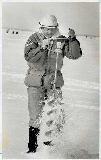Fishermen auger for good luck, A judge in striped vest sprints with Canada's Dave Morton, above, to his choice of a lucky hole in the ice while Finlan(...)