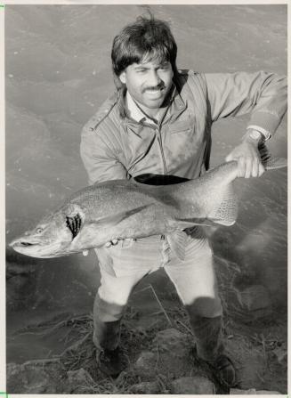 Pulled from the credit, Brampton angler Chris Rwoopan shows off a 25-pound King salmon he caught in the Credit River