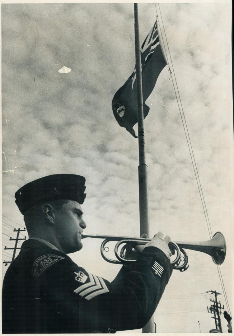 To a trumpet's blast the Red Ensign is lowered for the last time at Winston Churchill collegiate today