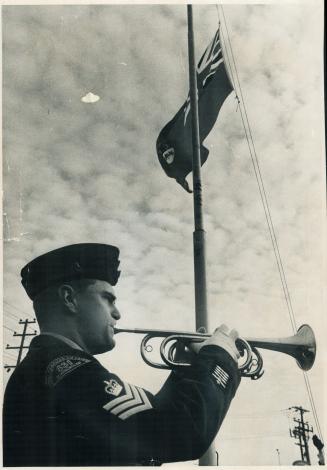 To a trumpet's blast the Red Ensign is lowered for the last time at Winston Churchill collegiate today