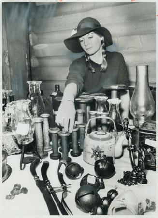Sleigh Bells, coal oil lamps and other household objects from the past are sold at Catherine Middleton's stall at the Snelgrove flea market, held every Sunday