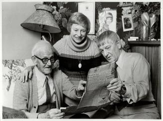 Looking back: Joe Ward, his daughter Greta and son Douglas remember, through old newspaper clippings, the dreadful time when all hell broke loose