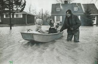 Weekend floods along Lake St. Clair force Jeff Cada and his family from their home, in St. Clair Beach. [Incomplete]