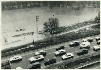Flooding Don creates traffic chaos, Southbound Don Valley Parkway traffic inches its way toward the Bloor St