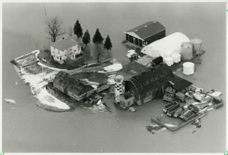 Island in flood: Aerial view shows flood-ravaged farm on the outskirts of Chatham