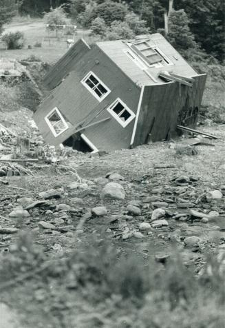 U.S. Flood, Pix show a house in a deep Raven, which fell as is when bank collapsed - owned by Mr. Rumsey who is in one pix, with house in back ground