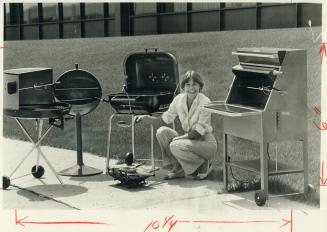 Bea Bradshaw with barbecues tested, from left, Solaray 2337E, Shepherd Ball B