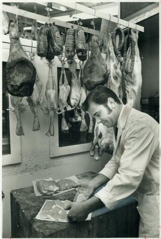 Fresh veal is cut to customer's order by butcher Rocco Senisi in Lombardi's