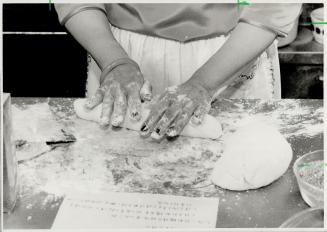 A delight: Mary Fok works on a dim sum treat called Knor M Chee (Sweet Glutinous Rice Dumplings) rolling dough, top and then putting in filling, bottom