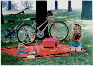 Bicycles, sandwiches, a blanket and a shady tree are the ingredients of an old-fashioned city picnic