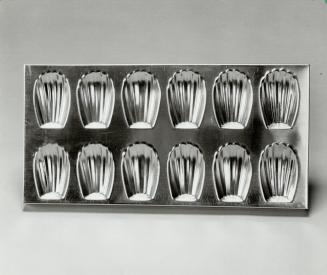 Madeleine pan, Madeleines: These memorable tea cakes are traditionally baked in this tray of shell-shaped Madeleine pans
