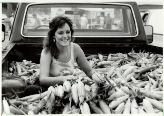 The corn is as high . . ., Sorting out corn at the farmers' market at Mississauga's Square One, Heather George, who trucks her produce in fresh from t(...)