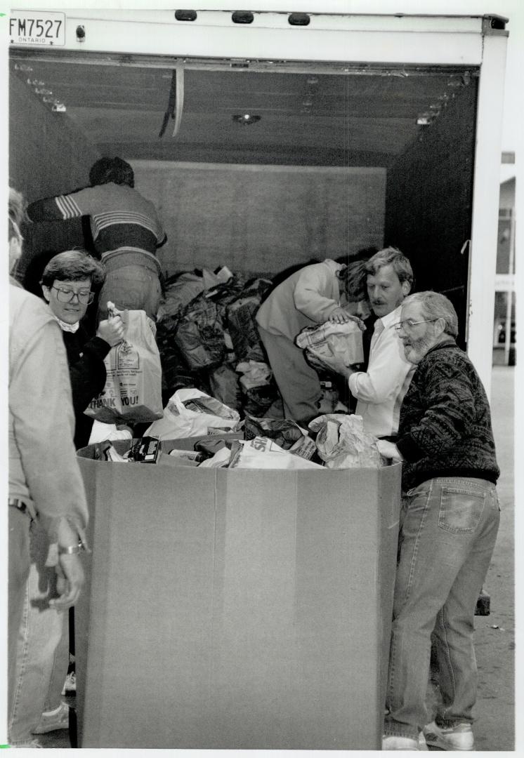 Meanwhile, volunteers at the Daily Bread Food Bank's temporary warehouse at Exhibition place hustle to handle the swell of donations, right. More than(...)