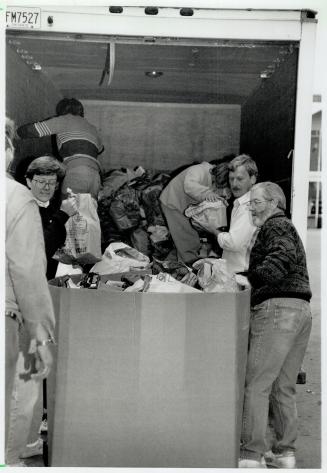 Meanwhile, volunteers at the Daily Bread Food Bank's temporary warehouse at Exhibition place hustle to handle the swell of donations, right. More than(...)
