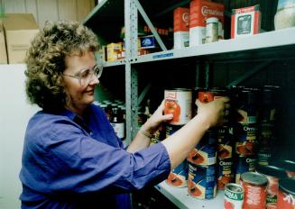 Taking stock: Marilyn Taylor, co-ordinator of Simcoe Hall Settlement House food bank, says supplies barely keep pace with demand