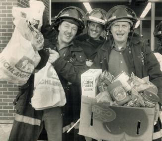 Firefighters John Sedgley, left, Al Cauchon and Grant Rennie at Toronto's Front St