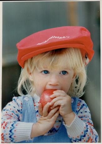C-c-c-r-runch!, Two-year-old Kimberley Smith gets her teeth into an apple ona visit to Chudleigh's Apple Farm near Milton