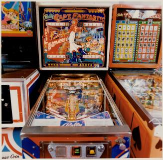 Left, The Captain Fantastic electronic pinball game features a picture of Elton John, built in 1976, it sells for $1,100 at The Right Stuff