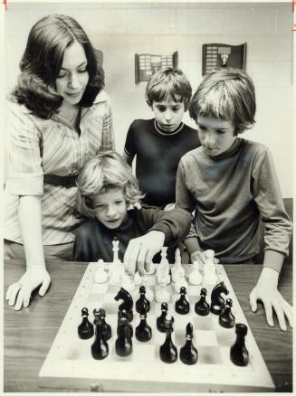 Members of Toronto's first chess school get a lesson from Canada's top woman player, Nava Shterenberg, left
