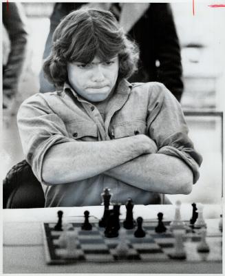 A Determined Challenger. Concentrating hard, George Klein, 18, was the last challenger to fall before chess master Walter Dobrich who's taking on all (...)