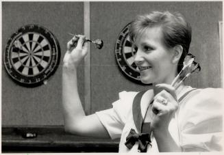 Right on: Arlene Tsimelkas of the newly formed Pickering Area Dart League takes aim at Gallagher's restaurant