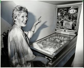 Gambler's delight: MacAulay had special hallway alcove built to house her beloved old pinball machine, above