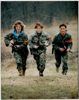 Weekend warriors, Kathy Johnston, left, and Debbie Cassibo, both field judges, play the Survivial Gamewith Richard Wall, manager of RDL games in Brook(...)