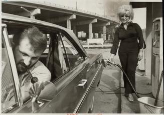 Rita Stocklin mans the gas pumps at her own Esso Station on the Lakeshore near Bathurst St