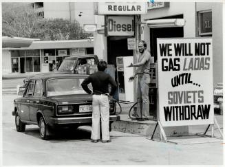 Sign of the times: Star reporter Rick Brennan argues with gas station owner Neil Shepherd, who's refusing to gas Russian-made Lada cars