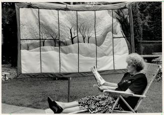 'Nude' landscape: Jean Webster of York Heritage Quilters' Guild, reclines beside A Marriage, by Laurie Swim, with nude figure in landscape