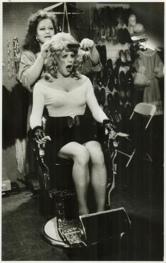 Paddy Aldridge, a partner in the Take a walk on the Wildside boutique, adjusts Bruce's wig