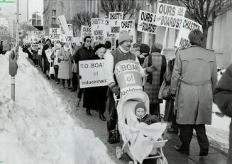 Signs of times: About 400 protesters turned out to show their displeasure with the dissemination of information about homosexuality in human sexuality units taught in Toronto secondary schools