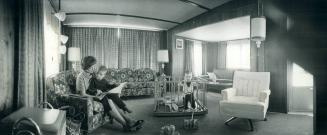 Spacious interior of a mobile home at Cooksville is evident in this photo of Mrs