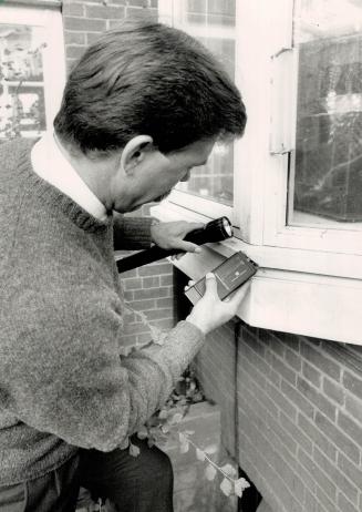 Close check: Home Inspector Bob Dunlop digs for clues to the health of some wooden window trim