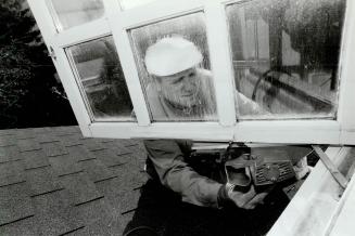 Clear improvement: Refitting a window to make it easier to operate is just one of the jobs tackled by Fred Maycock of the Metro firm Walder and McSweeney