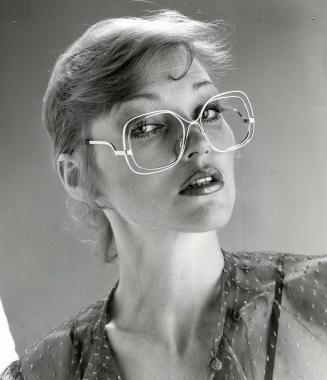 Light touch: Givenchy oulines clear lucite frames, above, to give the look of high style