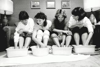 Footsore friends: The newest variation on Tupperware parties is a foot-soaker, in which people have their feet massaged in oil, bathed in soapy water, dried, scrubbed and covered with cream