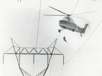 It's all in a day's work, A helicopter plucks a man from a power line, taking him from one job site to another on the 230-volt high-tension line between Cherrywood and Oshawa