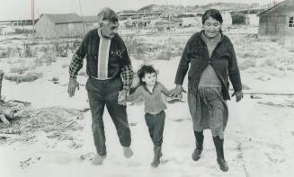 On the fringes of Matagami: Edward Ottereyes, 79, and wife Maria, 58, walk with their granddaughter, Linda, 4