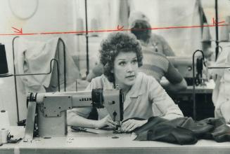 Machine sewing in Toronto's garment industry is one of the jobs Canada Manpower spokesmen say are the hardest to fill but Pauline Cole, who works in t(...)