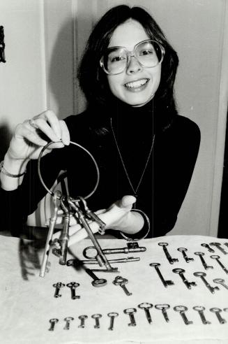 Favorite keys: Cathy Smalley, above, with part of her key collection, including a set of 19th century prison keys on a brass ring from Maine
