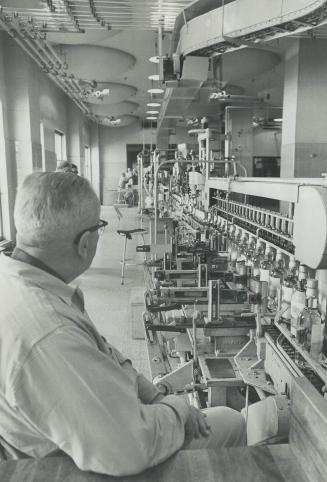 Bottling lines at the warehouse of the Liquor Control Board of Ontario, near foot of Yonge St