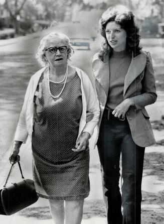 Cathy Stewart, 23, takes Mrs. Blanche Wright, 80, for a stroll as part of Local Initiatives Program