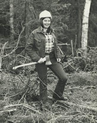 An axe is handy for the woman loggers-but just to keep in shape