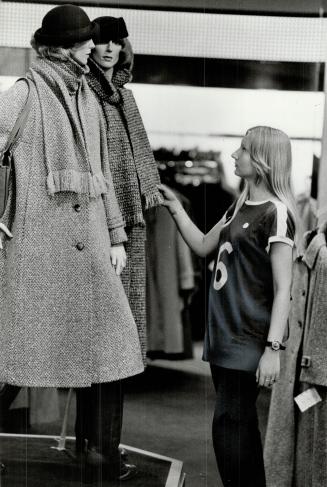 How to face the winter warmly, young shopper ponders