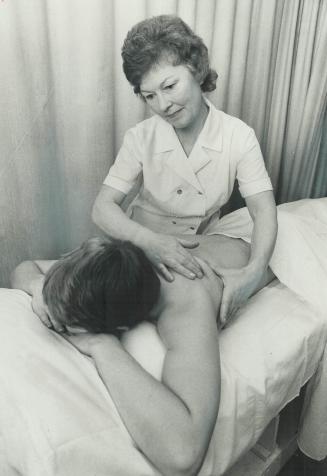 Masseuse Audrey Frazer treats a patient at the Ontario Massage Clinic, after St