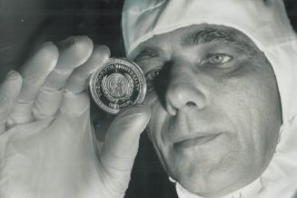 There's a mint in metro, Medal commemorating the 25th anniversary of the United Nations, struck at the Wellings Mint in Rexdale, is examined by Fred R(...)